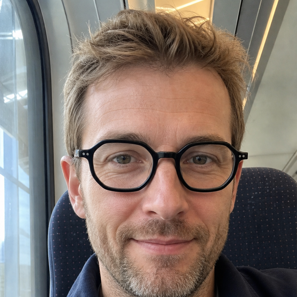 Audrey black acetate glasses worn by a customer