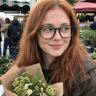 Hazel forest green acetate glasses worn by a customer