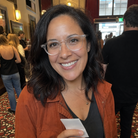Camille crystal clear acetate glasses worn by a customer