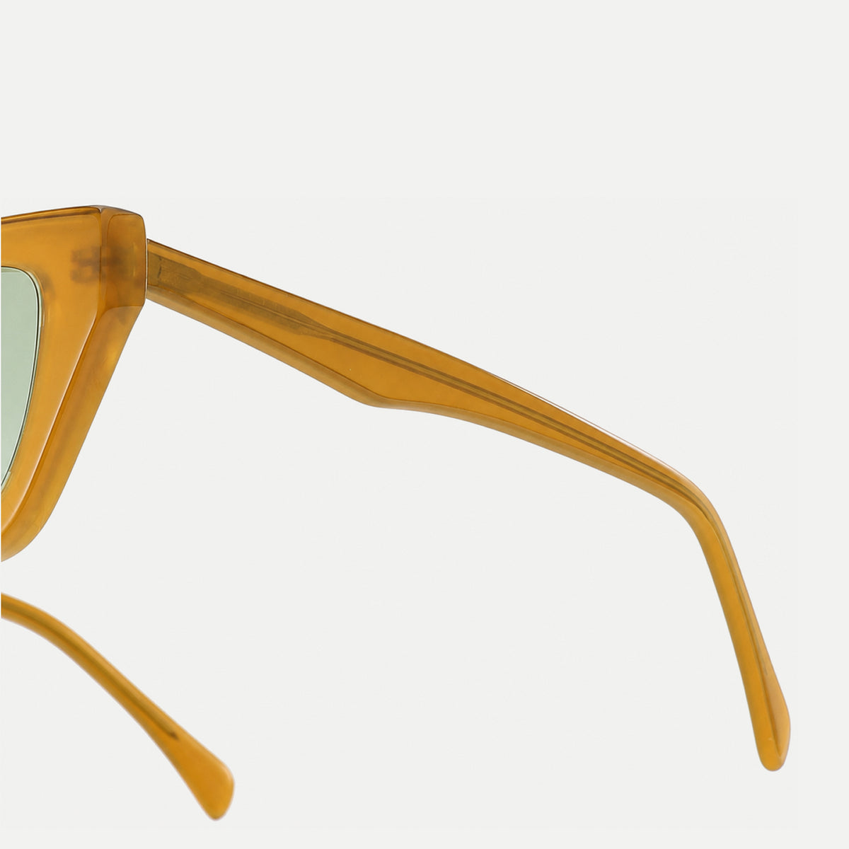 Lyra sunglasses - Crystal Amber / Light Green - temple detail